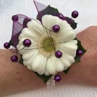 Purple and cream wrist corsage